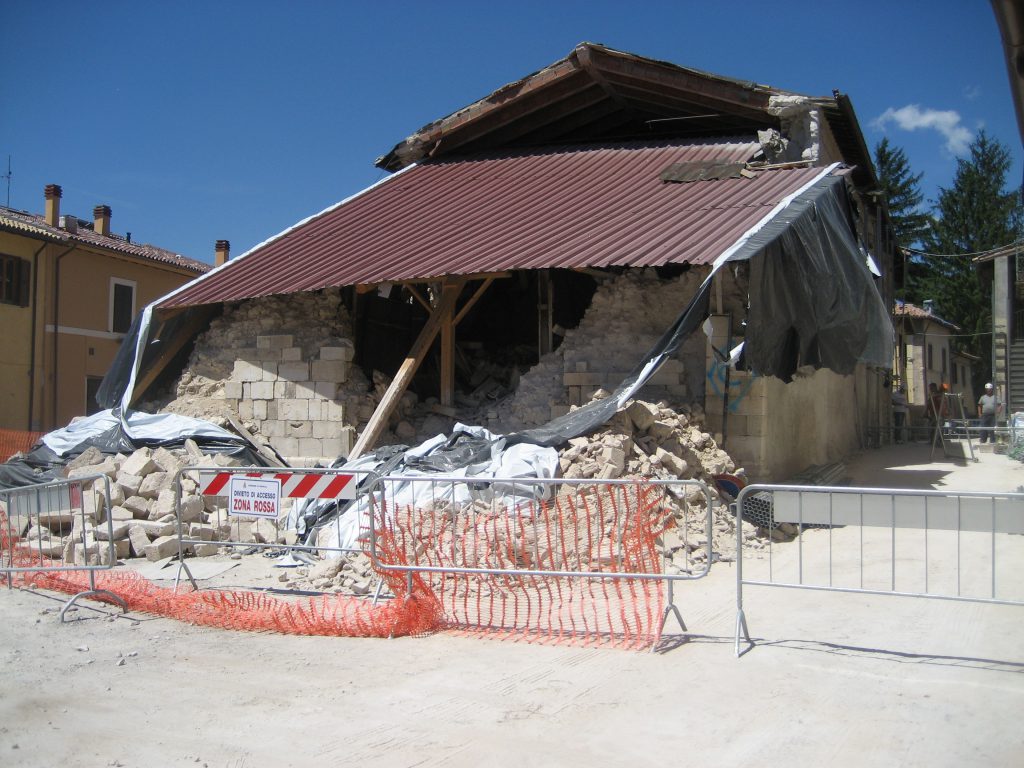 Crumbled church and some lonely workers far back, the only ones we saw in the city